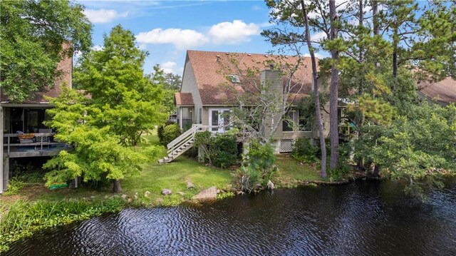 34 Chamale Cv Unit 34, Slidell, LA 70460 - back of property featuring stairs, a deck with water view, and a yard