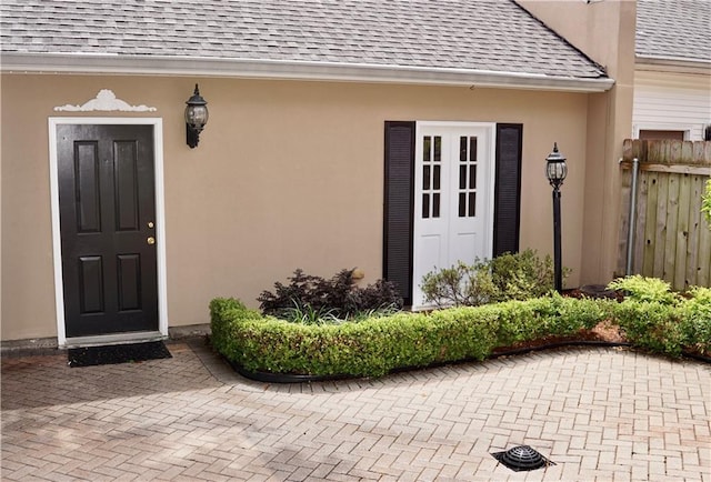 3739 N Hullen St, Metairie, LA 70002 - entrance to property with a shingled roof and stucco siding