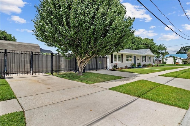 1200 Waltham St, Metairie, LA 70001 - view of front facade with a gate and concrete driveway