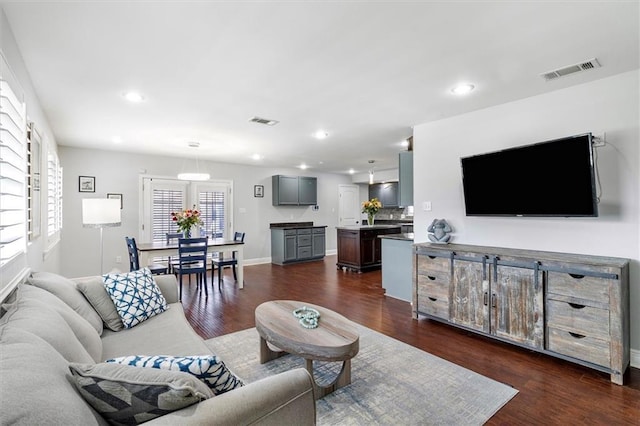 1200 Waltham St, Metairie, LA 70001 - living area featuring dark wood finished floors and recessed lighting
