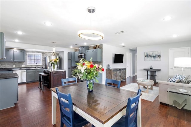 1200 Waltham St, Metairie, LA 70001 - dining room with dark wood-style floors and recessed lighting