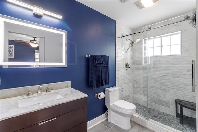 1200 Waltham St, Metairie, LA 70001 - full bathroom with vanity, a stall shower, a ceiling fan, and tile patterned flooring