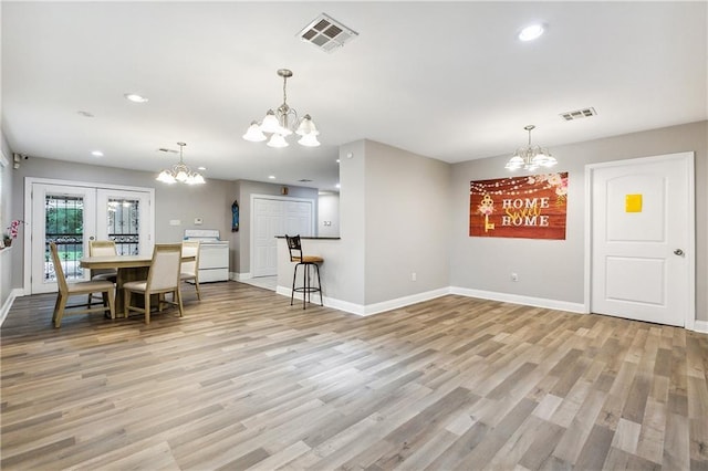 4925 Rhodes Dr, New Orleans, LA 70126 - dining area featuring a chandelier, light wood-style floors, and recessed lighting