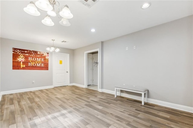 4925 Rhodes Dr, New Orleans, LA 70126 - unfurnished room featuring a chandelier, light wood-style flooring, and recessed lighting