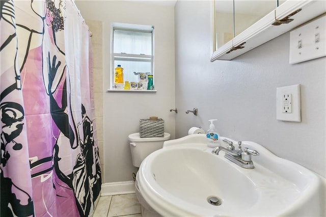 4925 Rhodes Dr, New Orleans, LA 70126 - full bathroom with tile patterned floors and a shower with curtain
