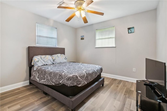 4925 Rhodes Dr, New Orleans, LA 70126 - bedroom with light wood-type flooring and ceiling fan