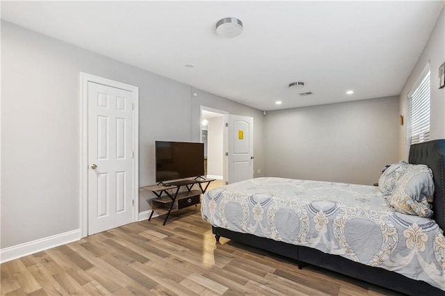 4925 Rhodes Dr, New Orleans, LA 70126 - bedroom with wood finished floors and recessed lighting