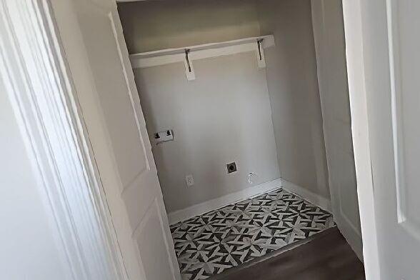 2678 Myrtle St, New Orleans, LA 70122 - washroom with electric dryer hookup and tile patterned floors