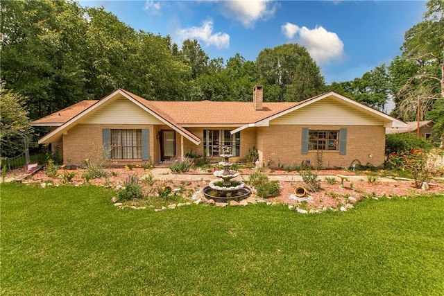2129 Hamilton St, Franklinton, LA 70438 - view of front of house with brick siding and a front lawn