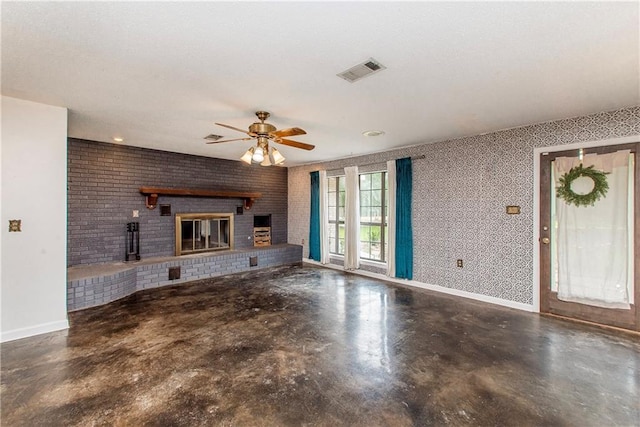 2129 Hamilton St, Franklinton, LA 70438 - unfurnished living room with concrete flooring, a fireplace, ceiling fan, and brick wall
