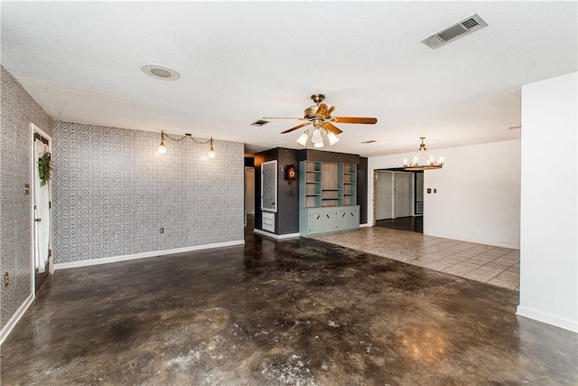 2129 Hamilton St, Franklinton, LA 70438 - unfurnished living room featuring concrete flooring, a chandelier, ceiling fan, and wallpapered walls