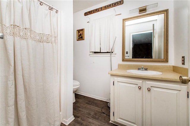 2129 Hamilton St, Franklinton, LA 70438 - bathroom with vanity, wood finished floors, and a shower with curtain