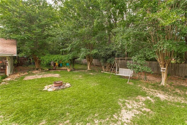 2129 Hamilton St, Franklinton, LA 70438 - view of yard featuring an outdoor fire pit