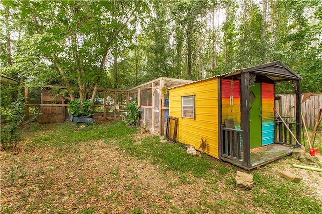 2129 Hamilton St, Franklinton, LA 70438 - view of property exterior featuring exterior structure, a fenced backyard, and an outbuilding