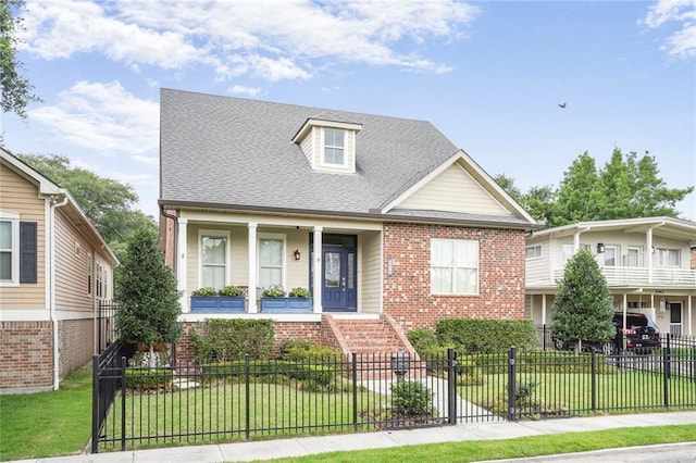 6938 Milne Blvd, New Orleans, LA 70124 - view of front of home with brick siding, a fenced front yard, covered porch, and roof with shingles