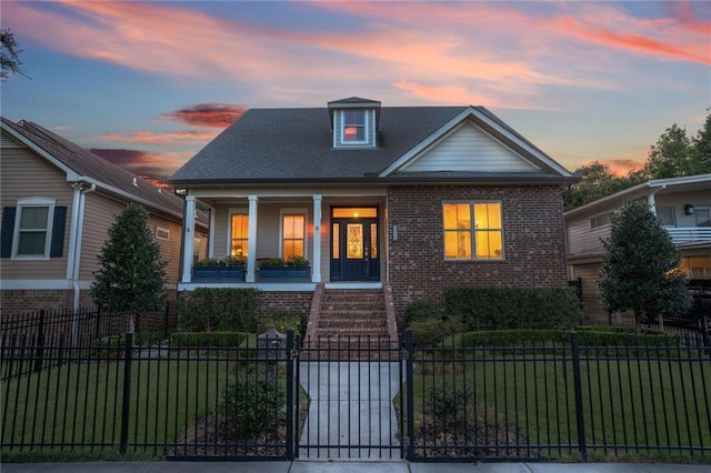 6938 Milne Blvd, New Orleans, LA 70124 - view of front of home featuring a porch, brick siding, a fenced front yard, stairway, and a gate