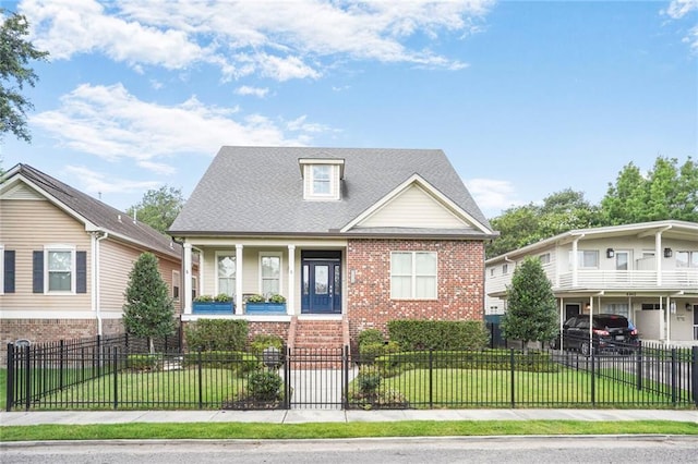 6938 Milne Blvd, New Orleans, LA 70124 - view of front facade featuring covered porch, brick siding, and a fenced front yard