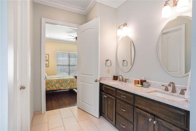 6938 Milne Blvd, New Orleans, LA 70124 - ensuite bathroom with double vanity, ornamental molding, a ceiling fan, and tile patterned floors