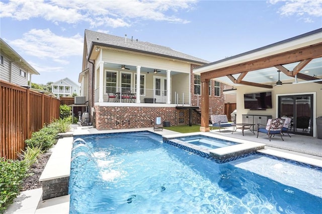 6938 Milne Blvd, New Orleans, LA 70124 - view of pool with ceiling fan, a fenced backyard, a pool with connected hot tub, and a patio area