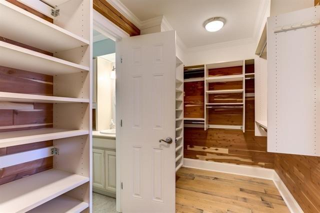 7300 Lakeshore Dr Unit 6, New Orleans, LA 70124 - spacious closet featuring wood finished floors