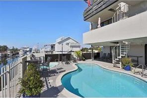 7300 Lakeshore Dr Unit 6, New Orleans, LA 70124 - view of swimming pool with a patio area
