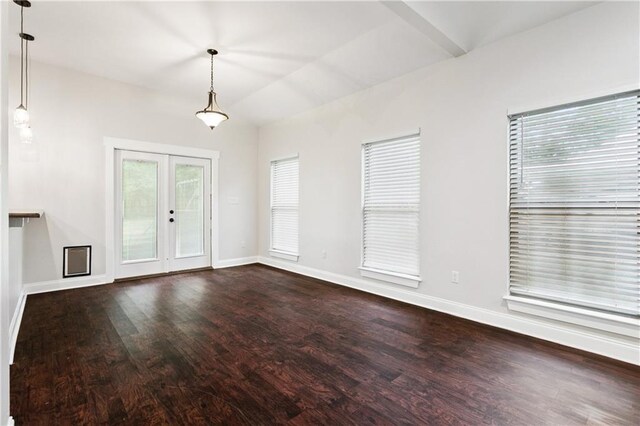 22562 2nd St, Mandeville, LA 70471 - unfurnished living room with dark wood-type flooring, french doors, and vaulted ceiling
