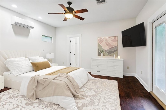 22562 2nd St, Mandeville, LA 70471 - bedroom featuring a wall unit AC, dark wood-type flooring, recessed lighting, and a ceiling fan