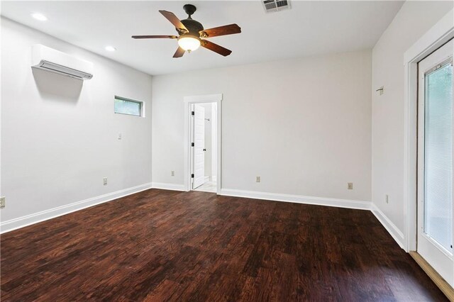 22562 2nd St, Mandeville, LA 70471 - spare room with an AC wall unit, wood finished floors, a ceiling fan, recessed lighting, and plenty of natural light