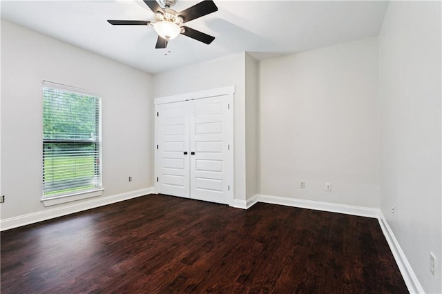 22562 2nd St, Mandeville, LA 70471 - unfurnished bedroom with wood finished floors, a closet, and a ceiling fan