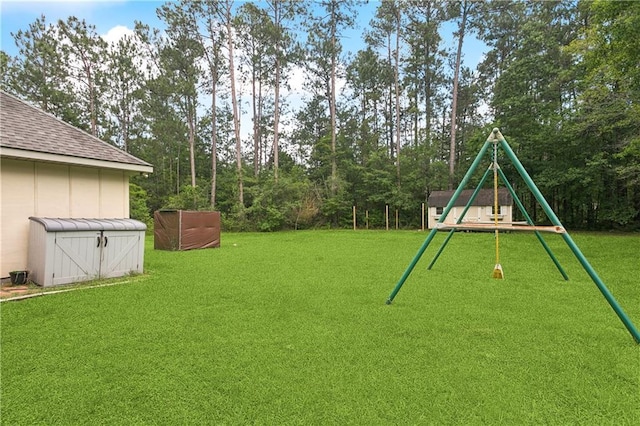22562 2nd St, Mandeville, LA 70471 - view of grassy yard featuring a playground and view of scattered trees