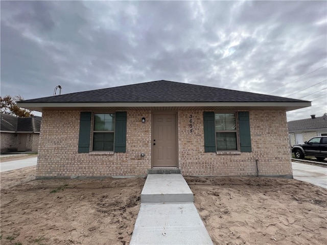 360507 Park Blvd, Chalmette, LA 70043 - view of front of home with brick siding and roof with shingles