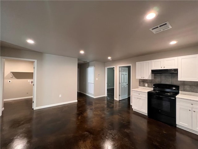 360507 Park Blvd, Chalmette, LA 70043 - kitchen featuring black electric range oven, under cabinet range hood, concrete flooring, tasteful backsplash, and white cabinets