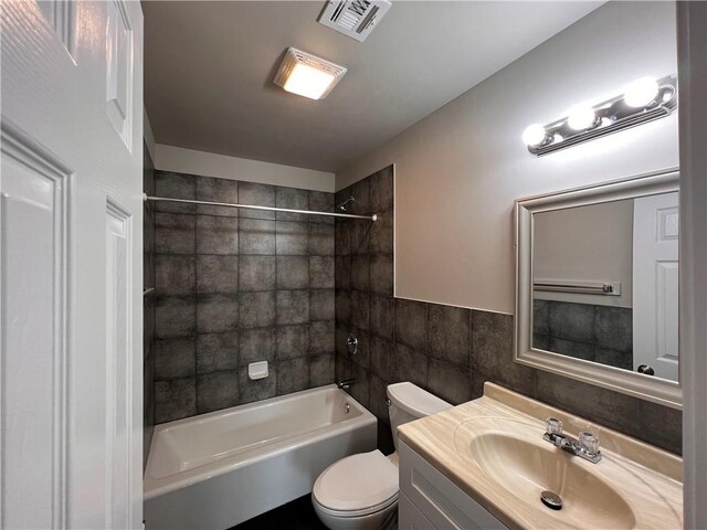 360507 Park Blvd, Chalmette, LA 70043 - bathroom with tile walls, vanity, and shower / tub combination