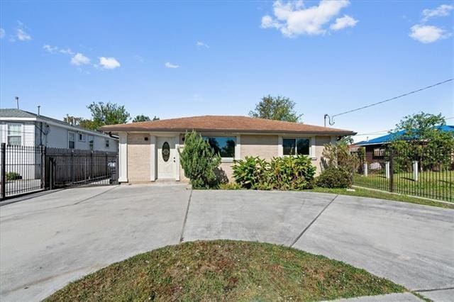 7109 Dreux Ave, New Orleans, LA 70126 - ranch-style home with concrete driveway