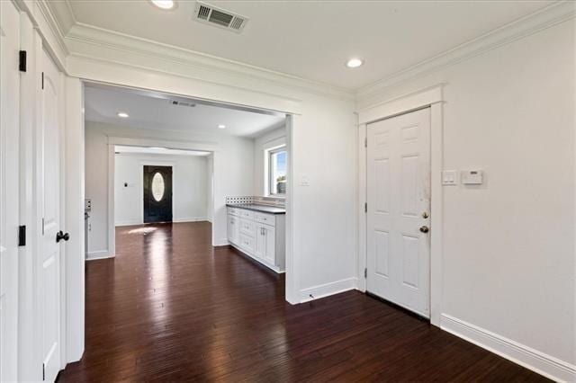 7109 Dreux Ave, New Orleans, LA 70126 - entrance foyer featuring crown molding, dark wood-style flooring, and recessed lighting