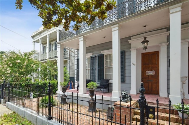 1128 Fourth St, New Orleans, LA 70130 - view of exterior entry featuring covered porch