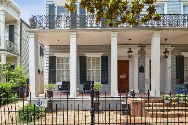 1128 Fourth St, New Orleans, LA 70130 - property entrance with a porch