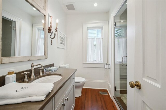 1128 Fourth St, New Orleans, LA 70130 - full bathroom featuring vanity, wood finished floors, and a shower stall