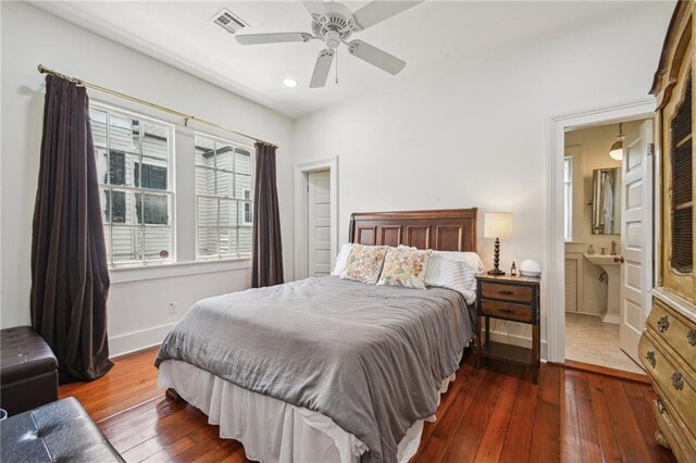 1128 Fourth St, New Orleans, LA 70130 - bedroom with wood-type flooring, recessed lighting, a ceiling fan, and connected bathroom