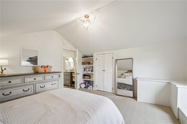1128 Fourth St, New Orleans, LA 70130 - bedroom with vaulted ceiling and a wainscoted wall