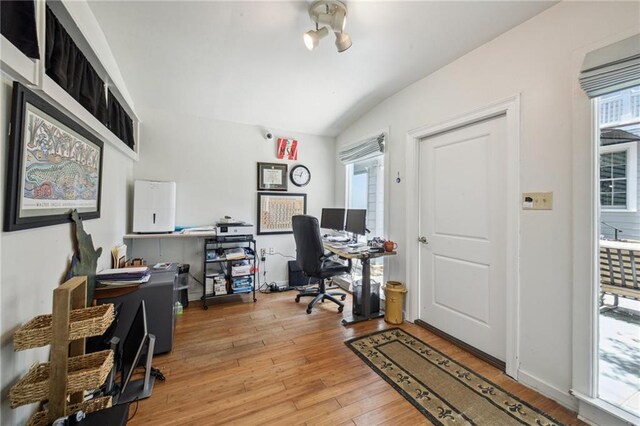 1128 Fourth St, New Orleans, LA 70130 - office area with vaulted ceiling and light wood-style flooring