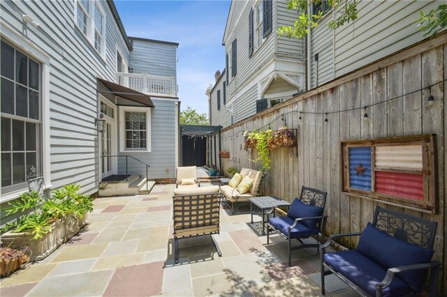 1128 Fourth St, New Orleans, LA 70130 - view of patio with an outdoor living space