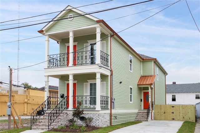 1704-1706 S Dupre St, New Orleans, LA 70125 - view of front facade featuring covered porch and a balcony