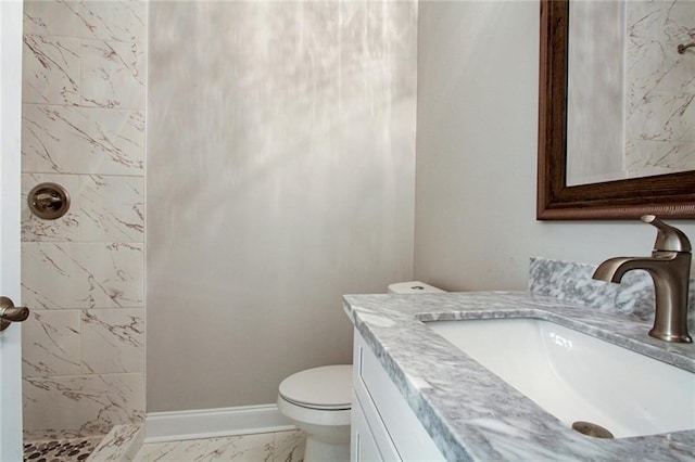 1704-1706 S Dupre St, New Orleans, LA 70125 - bathroom with marble finish floors, a stall shower, and vanity