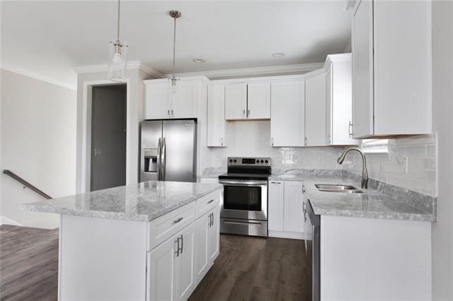 1704-1706 S Dupre St, New Orleans, LA 70125 - kitchen with appliances with stainless steel finishes, crown molding, light stone countertops, dark wood-style flooring, and white cabinetry