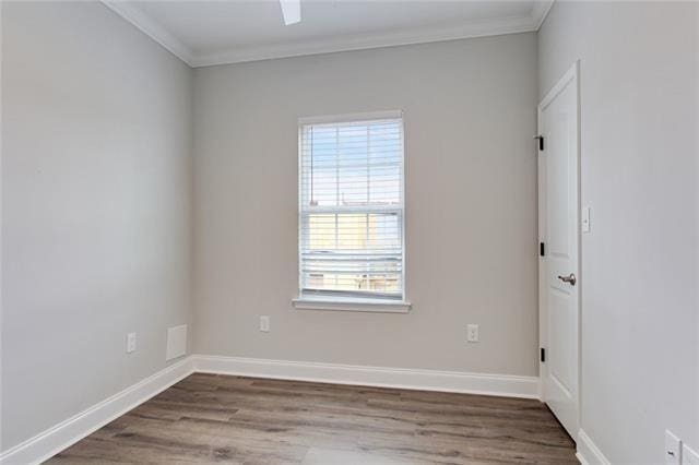 1704-1706 S Dupre St, New Orleans, LA 70125 - unfurnished room with ornamental molding and wood finished floors