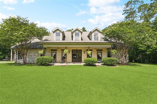 65045 Easy St, Pearl River, LA 70452 - cape cod home featuring a front yard, a porch, and stucco siding