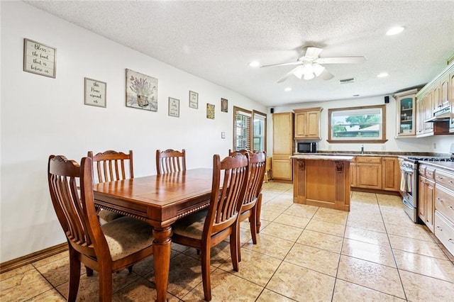 4520 13th St, Marrero, LA 70072 - dining room featuring a ceiling fan, a textured ceiling, recessed lighting, and light tile patterned floors