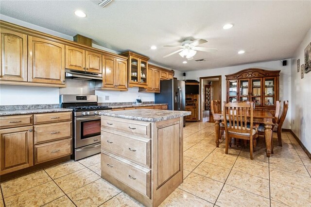 4520 13th St, Marrero, LA 70072 - kitchen with appliances with stainless steel finishes, under cabinet range hood, ceiling fan, a kitchen island, and recessed lighting