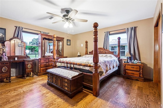 4520 13th St, Marrero, LA 70072 - bedroom with wood finished floors, multiple windows, and ceiling fan